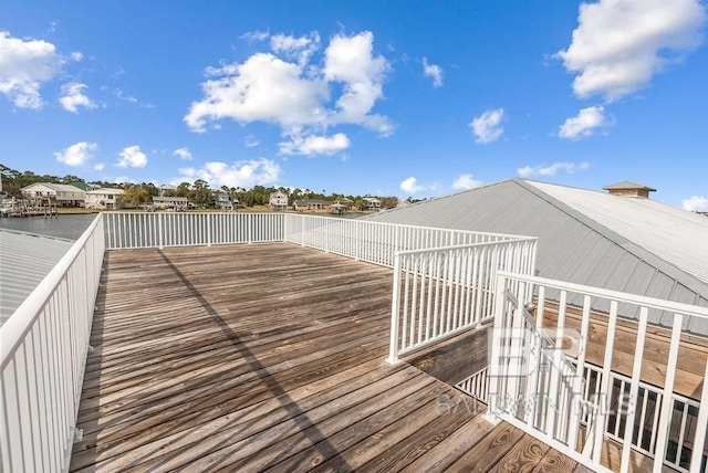 wooden terrace with a water view