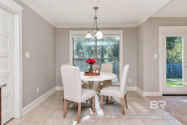 tiled dining space with an inviting chandelier and ornamental molding