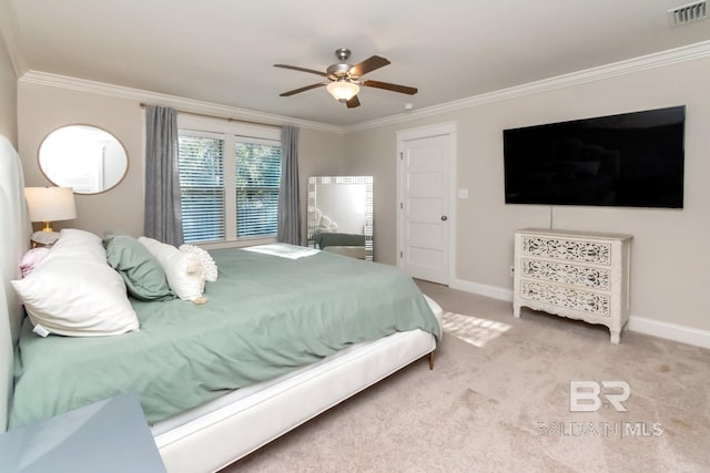 bedroom with ceiling fan, light colored carpet, and ornamental molding