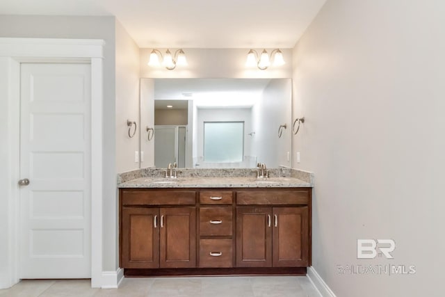 bathroom featuring tile patterned floors, vanity, and an enclosed shower