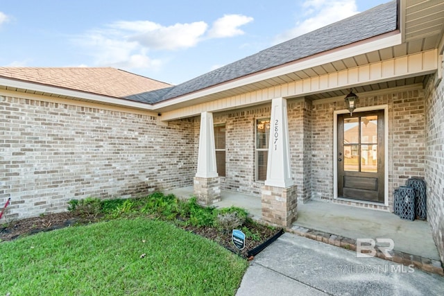 property entrance featuring covered porch