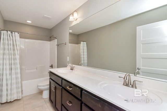 full bathroom featuring toilet, shower / bath combination with curtain, vanity, and tile patterned floors