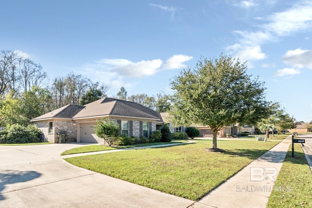 ranch-style house featuring a front yard and a garage