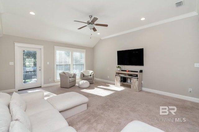 carpeted living room with lofted ceiling, ceiling fan, and ornamental molding