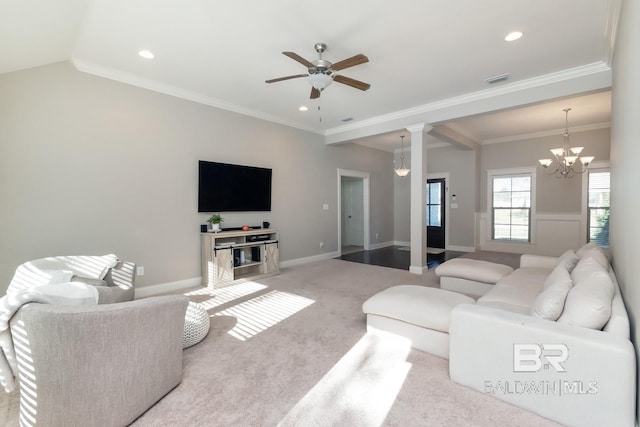 living room featuring light carpet, ceiling fan with notable chandelier, decorative columns, and ornamental molding