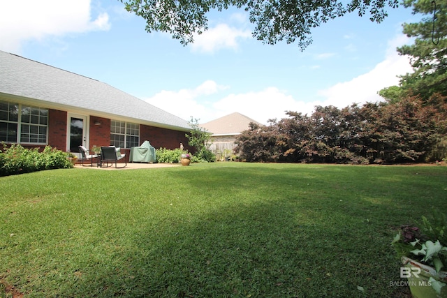7920 Eagle Creek Dr, Daphne, AL 36526 - view of green lawn featuring a patio