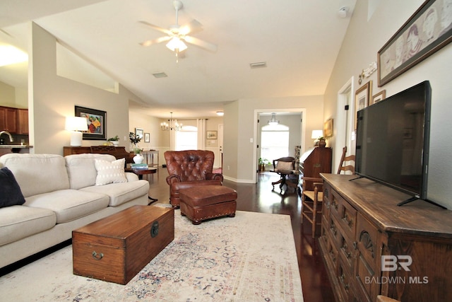 7920 Eagle Creek Dr, Daphne, AL 36526 - living area with a ceiling fan, a chandelier, dark wood-type flooring, vaulted ceiling, and baseboards