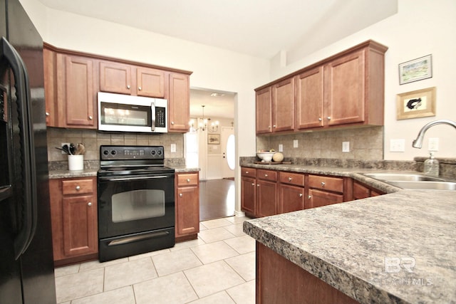 7920 Eagle Creek Dr, Daphne, AL 36526 - kitchen featuring black appliances, a sink, backsplash, a chandelier, and light tile patterned flooring