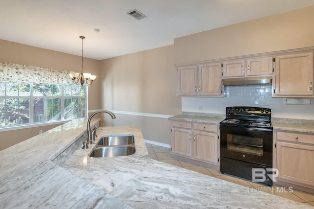 kitchen featuring black electric range oven, under cabinet range hood, light tile patterned floors, visible vents, and a sink