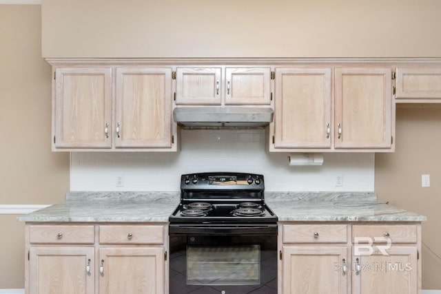 kitchen featuring black electric range oven, light brown cabinetry, and under cabinet range hood