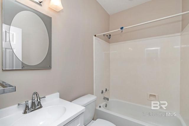 bathroom with toilet,  shower combination, and vanity