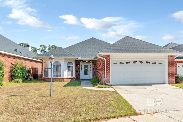 ranch-style home featuring a front yard, a garage, brick siding, and driveway