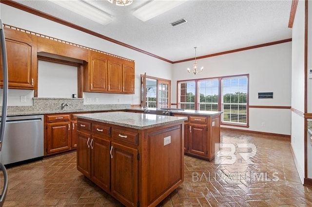 kitchen with a center island, hanging light fixtures, an inviting chandelier, stainless steel dishwasher, and a textured ceiling