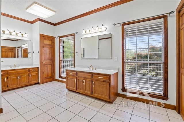 bathroom featuring tile patterned flooring, plenty of natural light, and crown molding