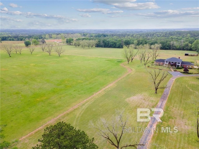 birds eye view of property featuring a rural view