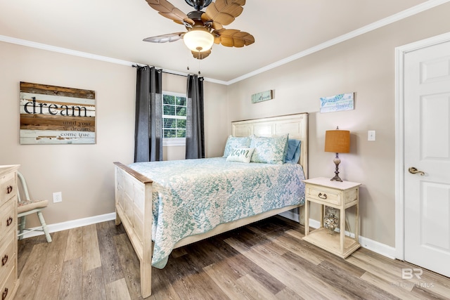 bedroom with ceiling fan, wood-type flooring, and crown molding