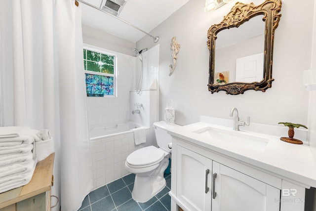 full bathroom with tile patterned flooring, vanity, toilet, and shower / bath combo with shower curtain