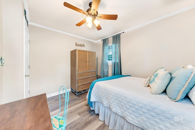 bedroom with ceiling fan, light hardwood / wood-style floors, and ornamental molding