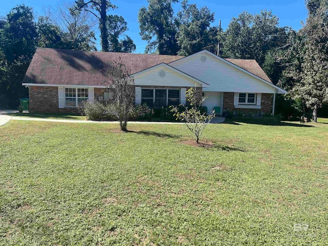 ranch-style home with a front yard