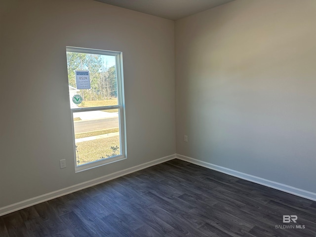 13729 Shea Cir, Foley, AL 36535 - spare room featuring dark wood-style flooring and baseboards