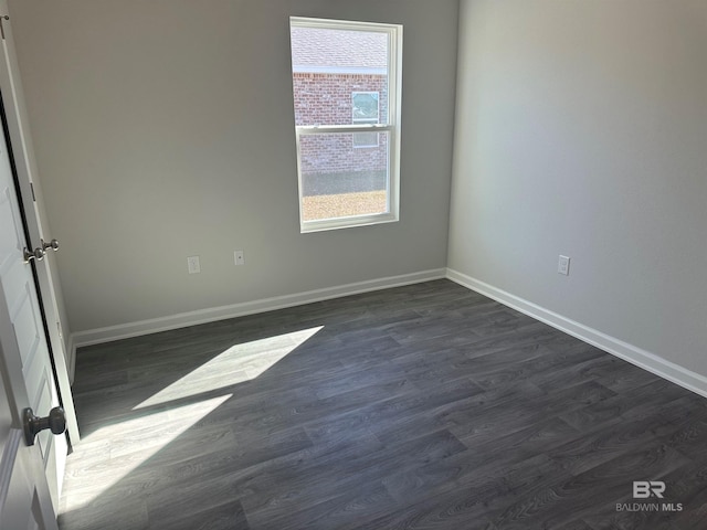 13729 Shea Cir, Foley, AL 36535 - unfurnished room with baseboards and dark wood-style floors