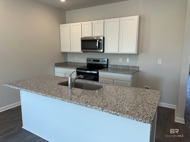 13729 Shea Cir, Foley, AL 36535 - kitchen with stainless steel appliances, a sink, light stone countertops, and baseboards