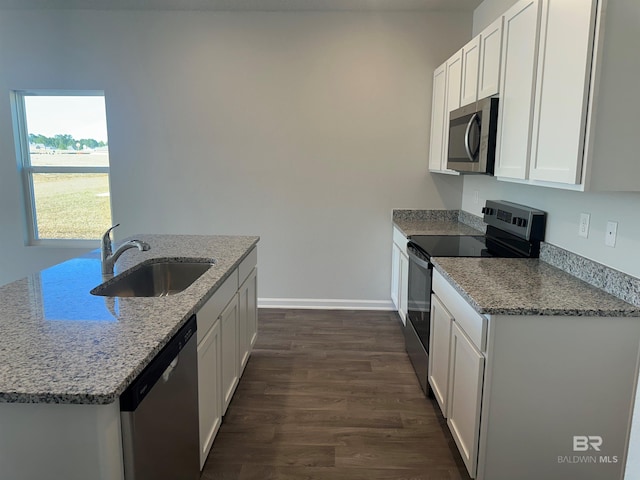 13729 Shea Cir, Foley, AL 36535 - kitchen with appliances with stainless steel finishes, a sink, dark wood-type flooring, white cabinets, and light stone counters