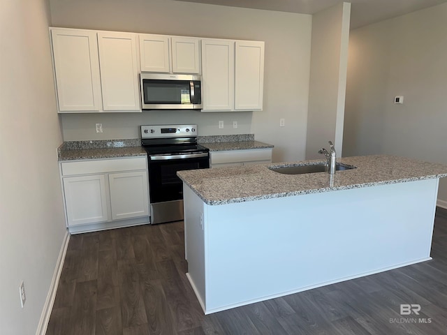 13729 Shea Cir, Foley, AL 36535 - kitchen with stainless steel appliances, a sink, dark wood-style flooring, and white cabinetry