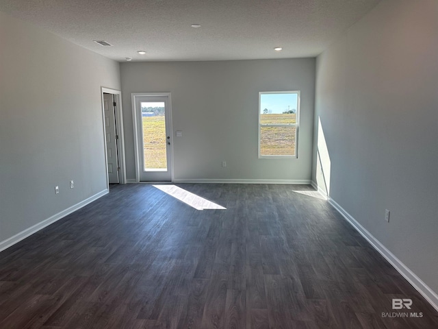 13729 Shea Cir, Foley, AL 36535 - empty room with dark wood-style floors, a textured ceiling, baseboards, and recessed lighting