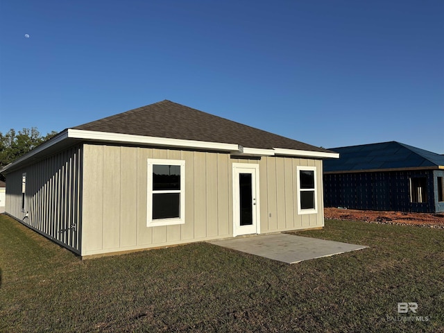 13729 Shea Cir, Foley, AL 36535 - rear view of house with a lawn, board and batten siding, and a shingled roof
