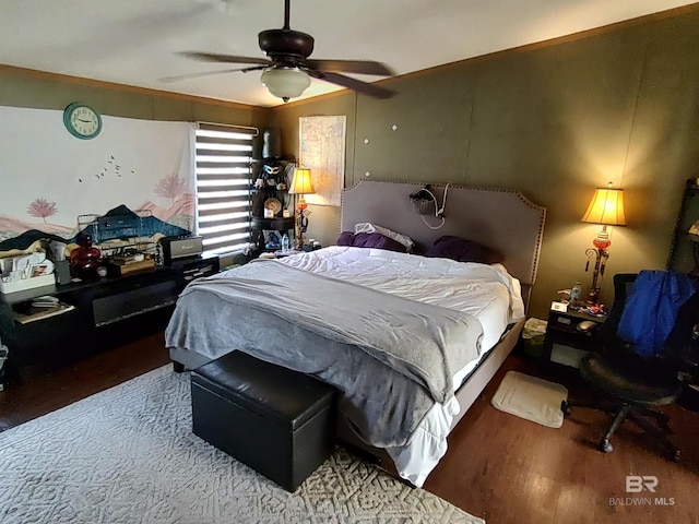 bedroom with hardwood / wood-style floors and ceiling fan