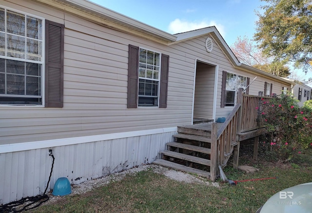 entrance to property with a wooden deck