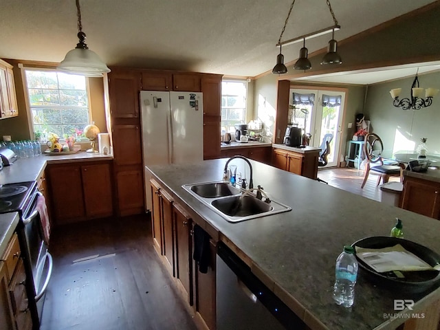 kitchen featuring dark hardwood / wood-style flooring, sink, a wealth of natural light, and stainless steel appliances