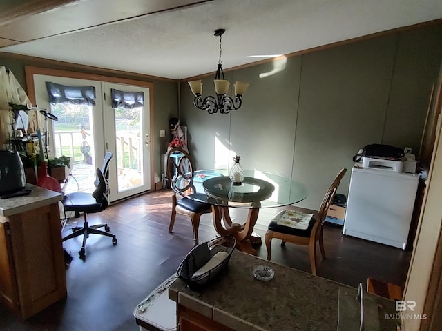 dining room featuring a chandelier, french doors, and dark wood-type flooring