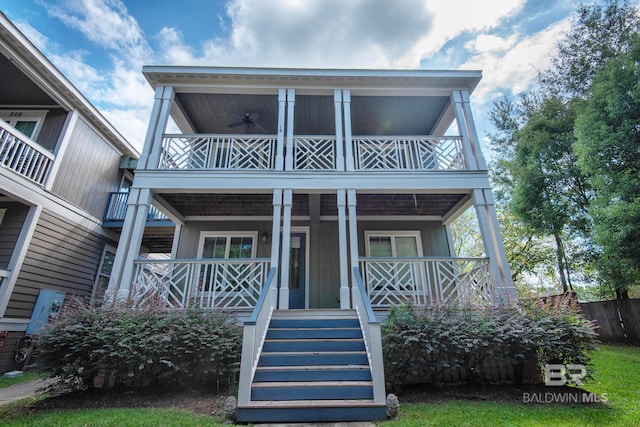 view of front of house featuring a balcony