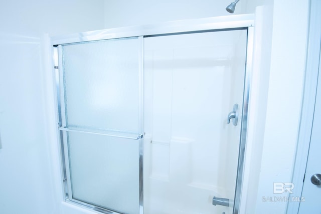 bathroom featuring an enclosed shower