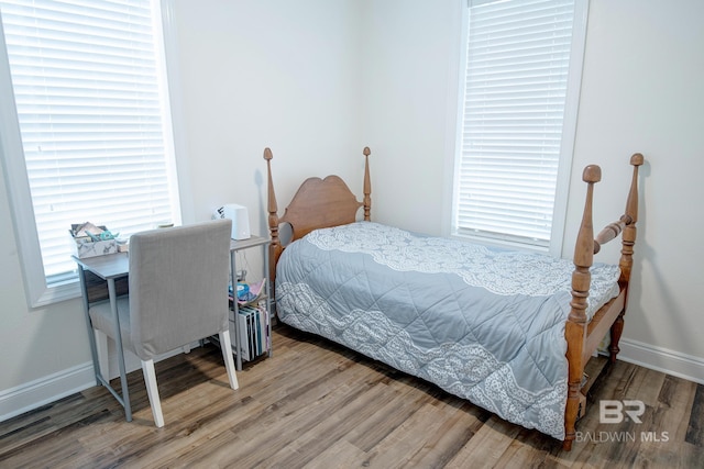 bedroom with hardwood / wood-style floors