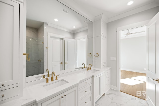 bathroom featuring vanity, ceiling fan, an enclosed shower, and crown molding