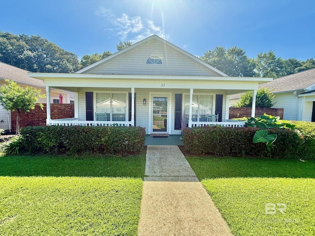 33 Cottage Dr, Fairhope, AL 36532 - view of front of house with covered porch and a front lawn