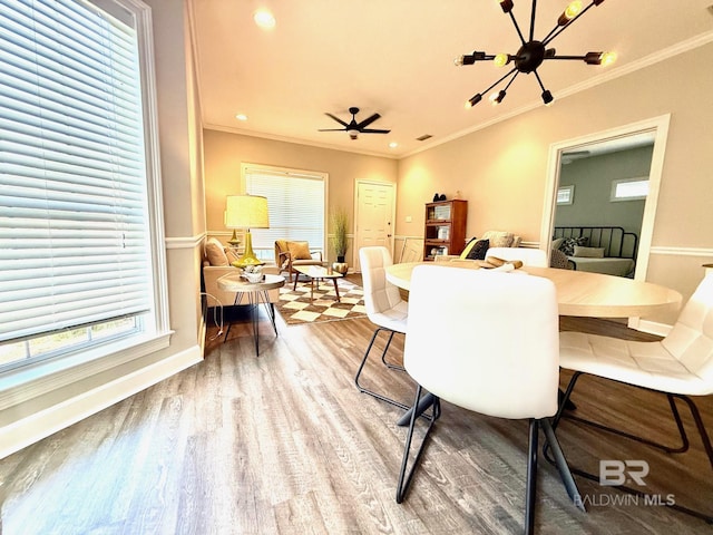 33 Cottage Dr, Fairhope, AL 36532 - dining space featuring wood finished floors, crown molding, and plenty of natural light