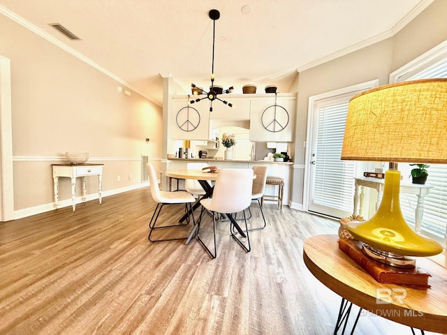 33 Cottage Dr, Fairhope, AL 36532 - dining space featuring crown molding, light wood-style floors, and ceiling fan