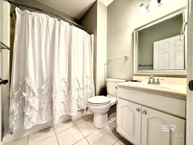 33 Cottage Dr, Fairhope, AL 36532 - bathroom featuring tile patterned flooring, vanity, a textured ceiling, and curtained shower