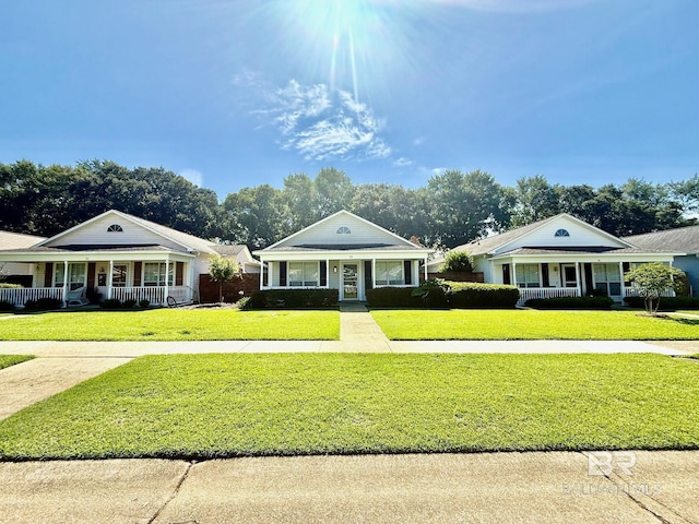 33 Cottage Dr, Fairhope, AL 36532 - greek revival house with a porch and a front yard