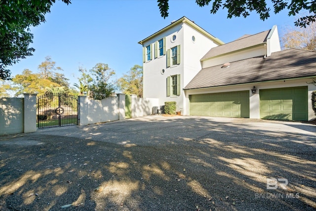 view of property exterior with a garage