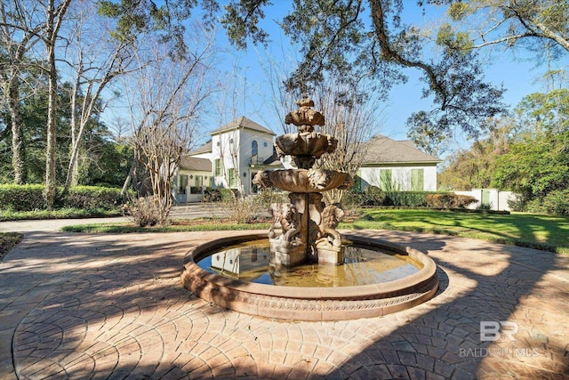 view of home's community with a lawn