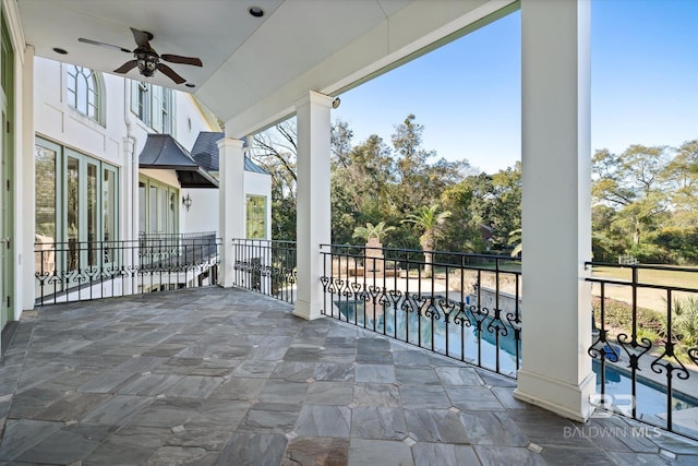 view of patio featuring ceiling fan