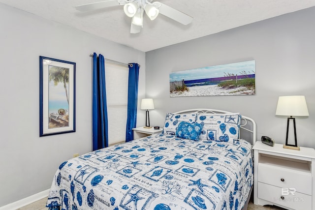 24160 Perdido Beach Blvd Unit 2073, Orange Beach, AL 36561 - bedroom with ceiling fan and a textured ceiling