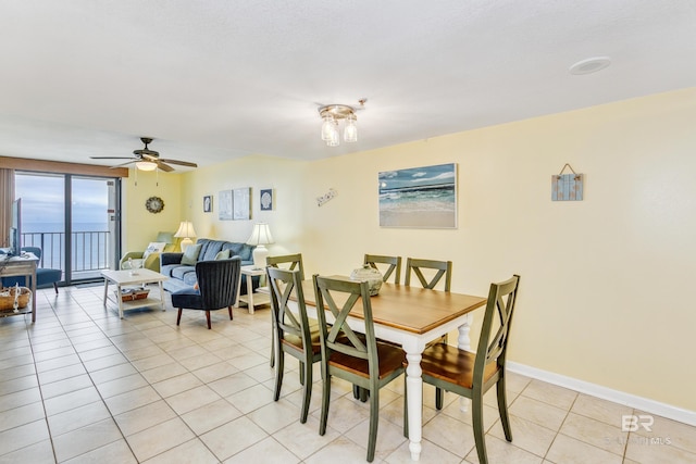 24160 Perdido Beach Blvd Unit 2073, Orange Beach, AL 36561 - dining area featuring ceiling fan and light tile patterned floors