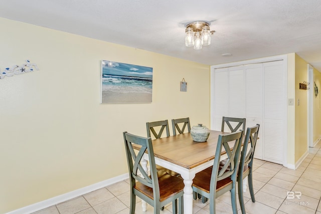 24160 Perdido Beach Blvd Unit 2073, Orange Beach, AL 36561 - dining space with light tile patterned floors and a textured ceiling