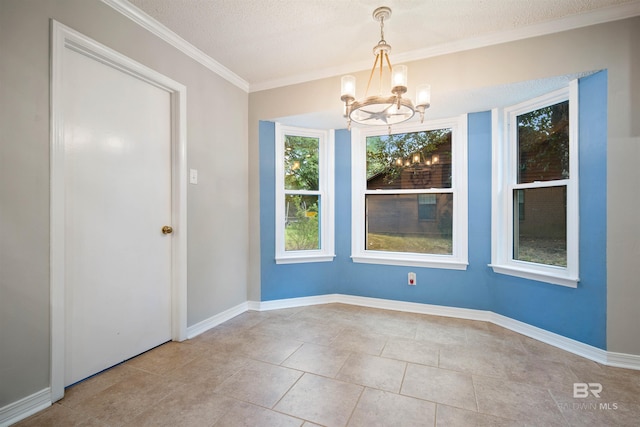 unfurnished dining area featuring a textured ceiling, crown molding, an inviting chandelier, and light tile patterned floors